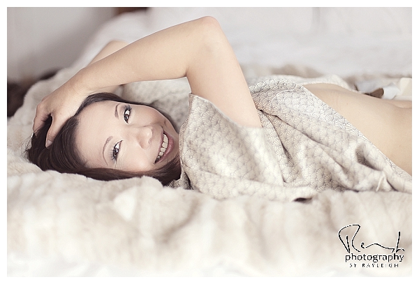 Beauty in a Kimono. Boudoir Photography by Rayleigh. This is an image of an Asian woman lying on her back on the bed. For more info, visit byrayleigh.com