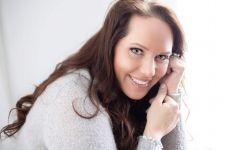 A beauty photo shoot in a studio in Portland, OR. This is a headshot photo near a window.