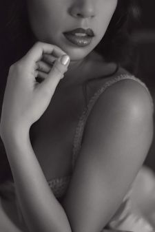 A close up Portland, OR studio boudoir photo focused on the lips and shoulder.