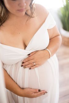 a close up studio boudoir maternity photo taken in Salem, OR. This is a close up belly pose.