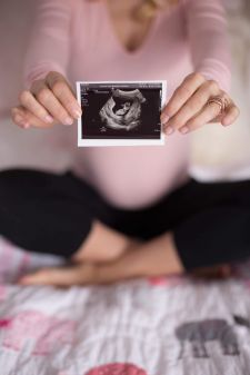 a studio maternity photo taken in Tigard, OR. This photo is a close up of a sonogram.