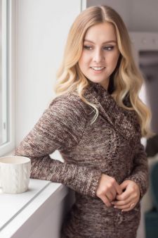 A beauty photo shoot in a studio in Portland, OR. This is a standing pose against a wall and window sill.