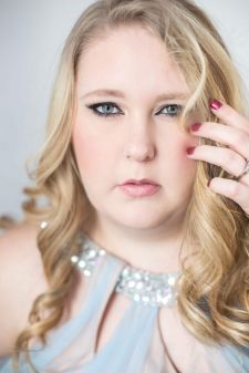 A plus size beauty photo shoot in a studio in Portland, OR. This is a close up headshot.