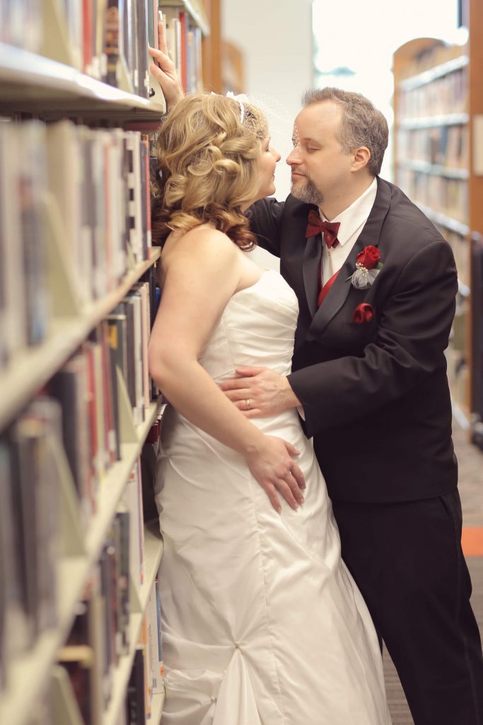 A bride and groom almost kissing during their couples photo shoot at their Valentine's Day Wedding. The wedding was held at the library in Hillsboro, OR near Portland.